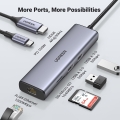 Adapter Ugreen CM512 90568 USB-C - 2x USB-A 3.0 / HDMI / RJ45 / czytnik kart SD i TF / USB-C PD 100W - szary